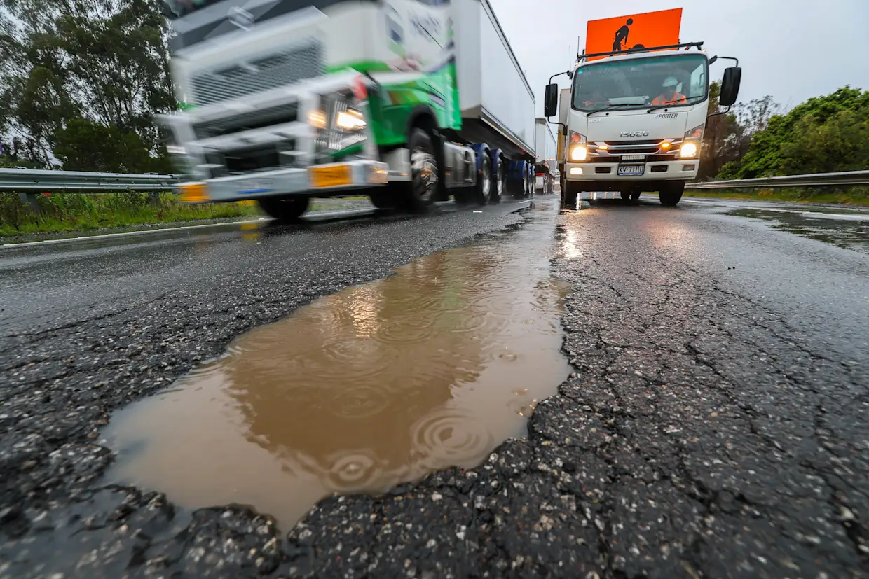 Cars stranded on the Princes Freeway after a large pothole near Bunyip damaged tyres and rims