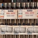 Costco-style Kentucky bourbon whiskey bottles highlighting 2021 vs. 2026 prices