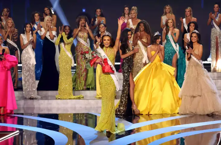 Miss USA pageant winner on stage with contestants during the crowning ceremony