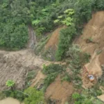 SH3 roadworks beside a weather-damaged slip in Awakino Gorge, New Zealand