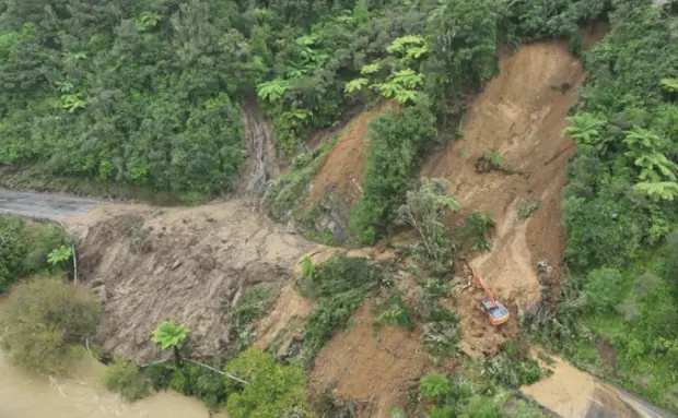 SH3 roadworks beside a weather-damaged slip in Awakino Gorge, New Zealand