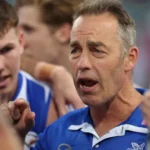 Alastair Clarkson coaching North Melbourne during an AFL match
