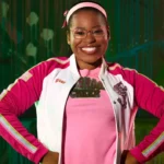 Carla Jeffery as Bree in Disney Channel’s Zombies franchise, wearing a pink Seabrook cheer outfit.