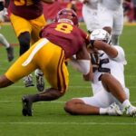 Dante Moore taken by ambulance after USC hit