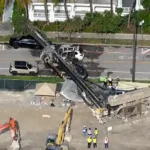 Collapsed crane near a damaged SUV in Miami’s Brickell neighborhood