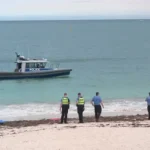 Police search Sorrento Beach near Perth after a suspected shark attack and swimmer disappearance