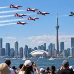 Canadian International Air Show aircraft flying over Toronto waterfront in 2026