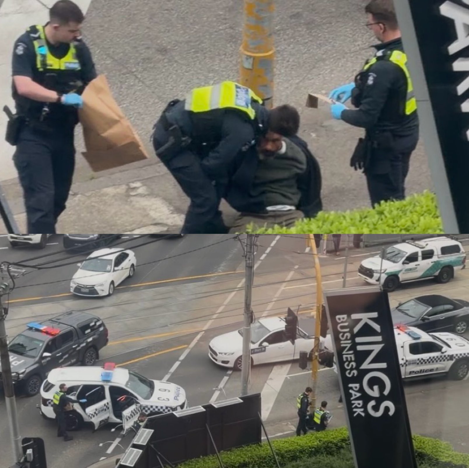 Police officers detain a man near Kings Business Park