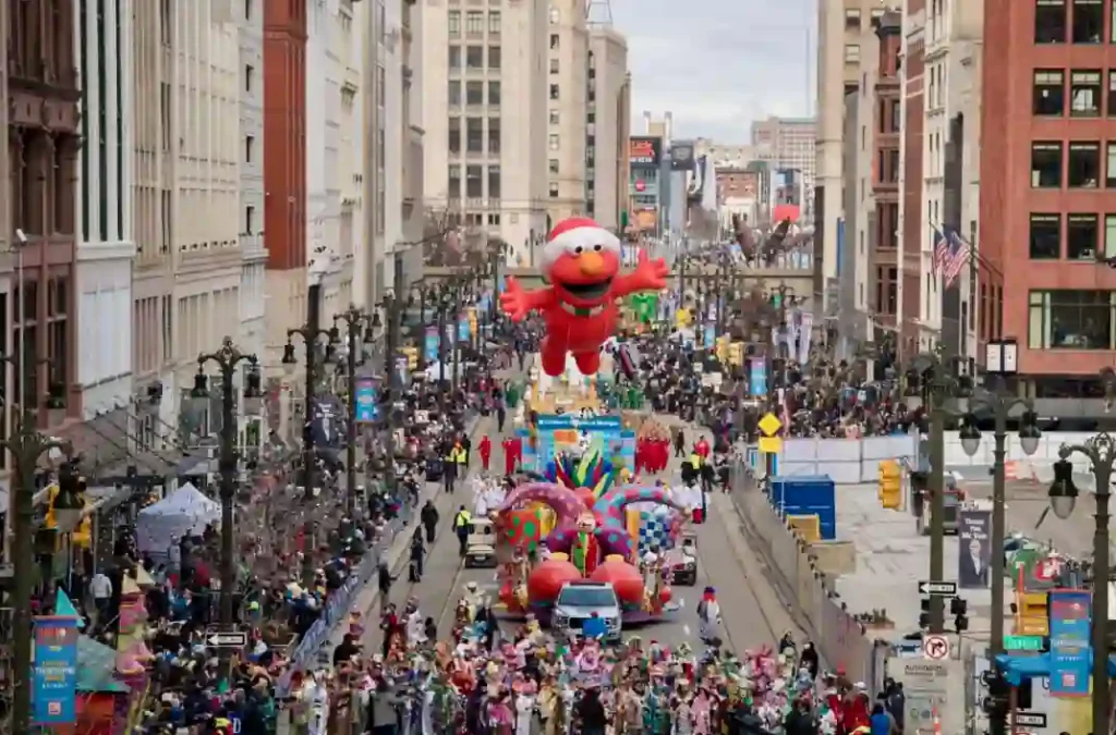 Giant Thanksgiving parade balloon, colorful floats and marching bands on Woodward Avenue in downtown Detroit.
