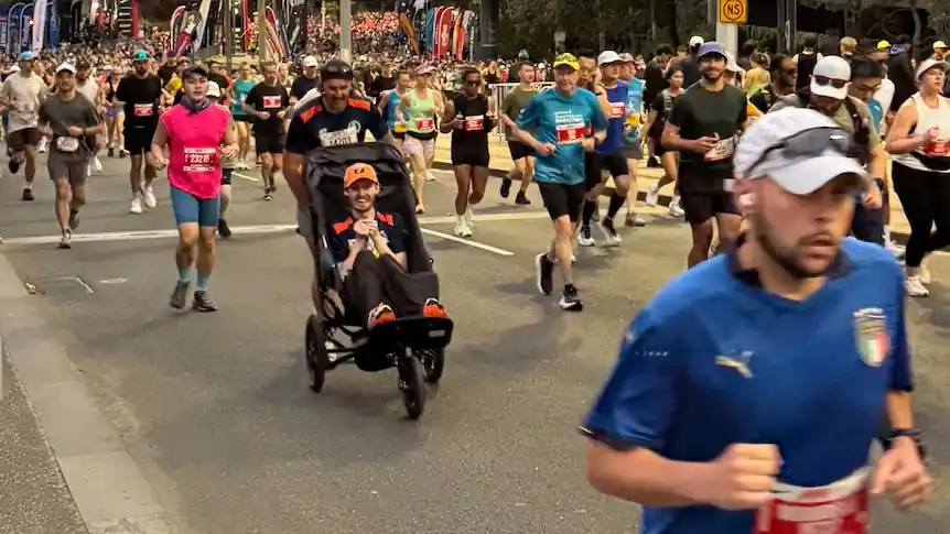 Melbourne Marathon Runner Pushes Cousin With Rare Disease 42KM