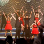 High school musical auditorium stage representing the Glee reboot confirmed for Disney+ and Hulu in October 2026.