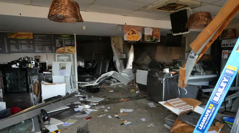 Four-wheel-drive crash damages Shearwater Food Company cafe shopfront in Tasmania.