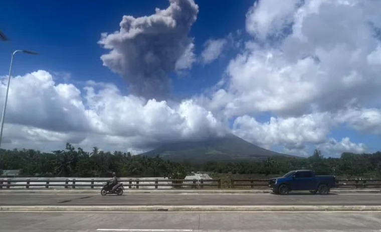 Mayon Volcano eruption in Albay, Philippines, with a towering gray ash plume rising above its summit on October 30, 2026.